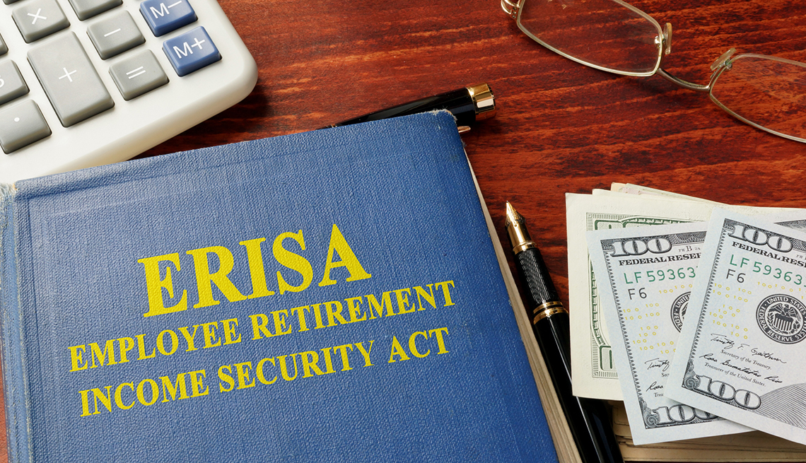 a book on a table titled e r i s a employee retirement income security act